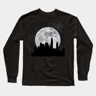 Silhouette of a city against a giant moon Long Sleeve T-Shirt